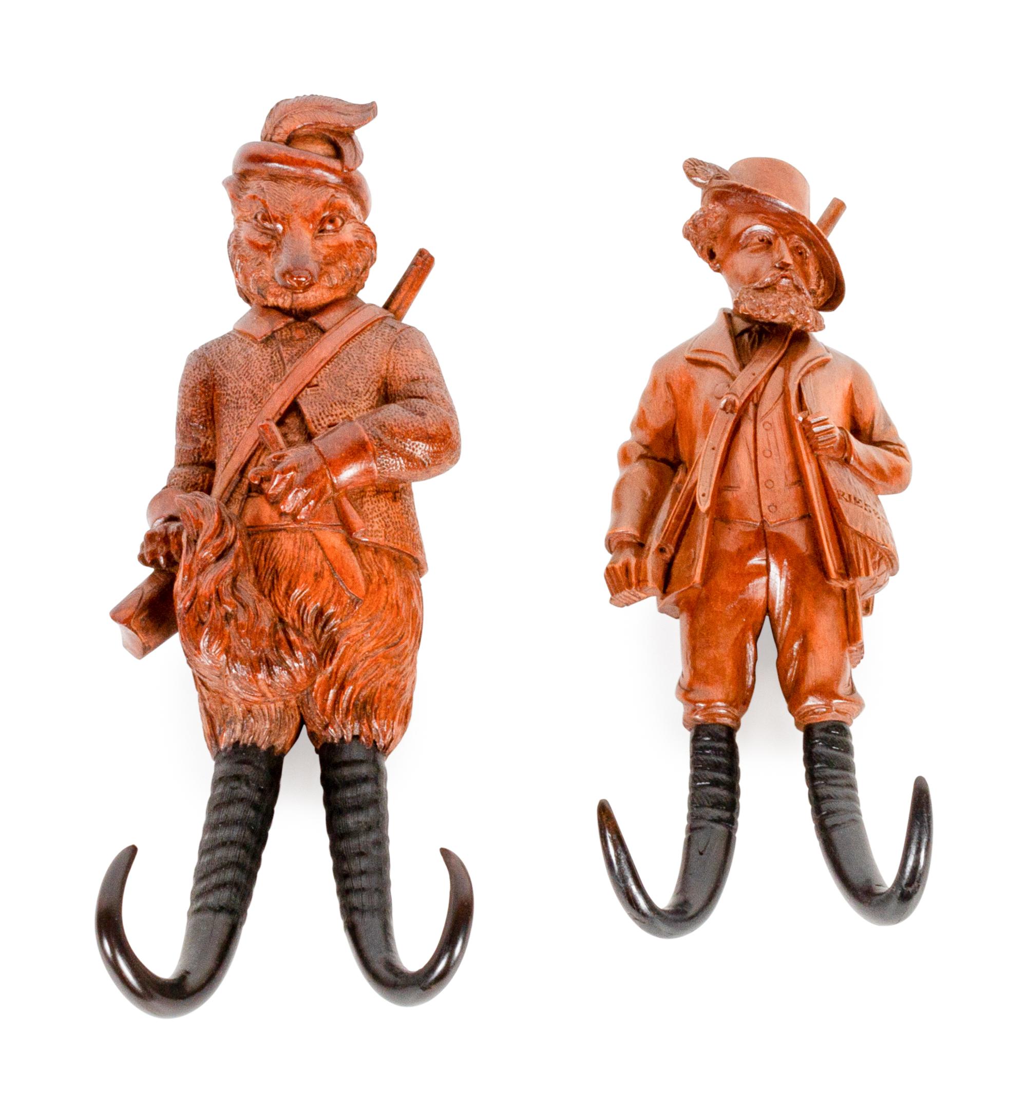 Two Black Forest Carved Wood Whip Hooks