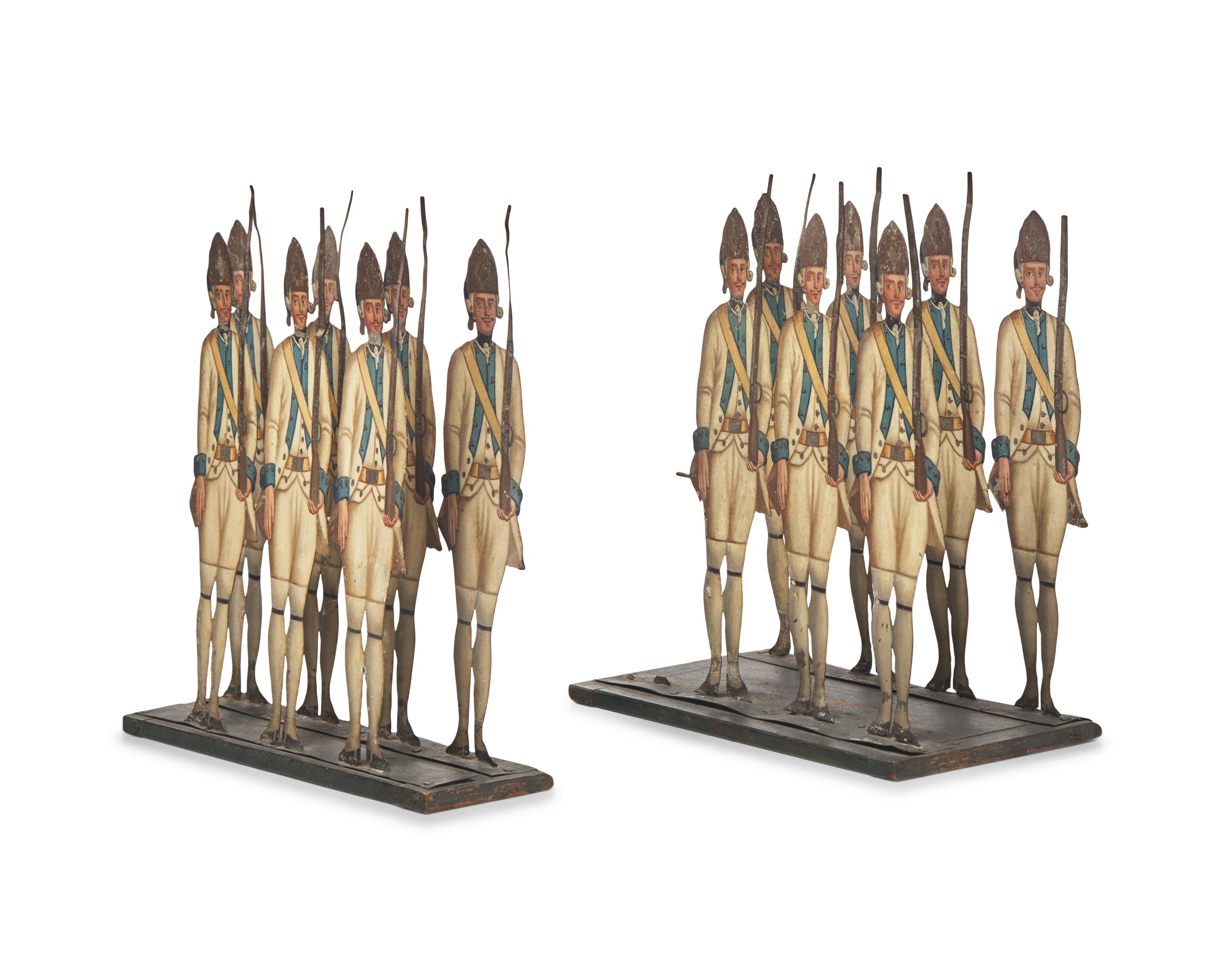 A Group of Fourteen Lithographed Tin Toy Figures of French Grenadiers