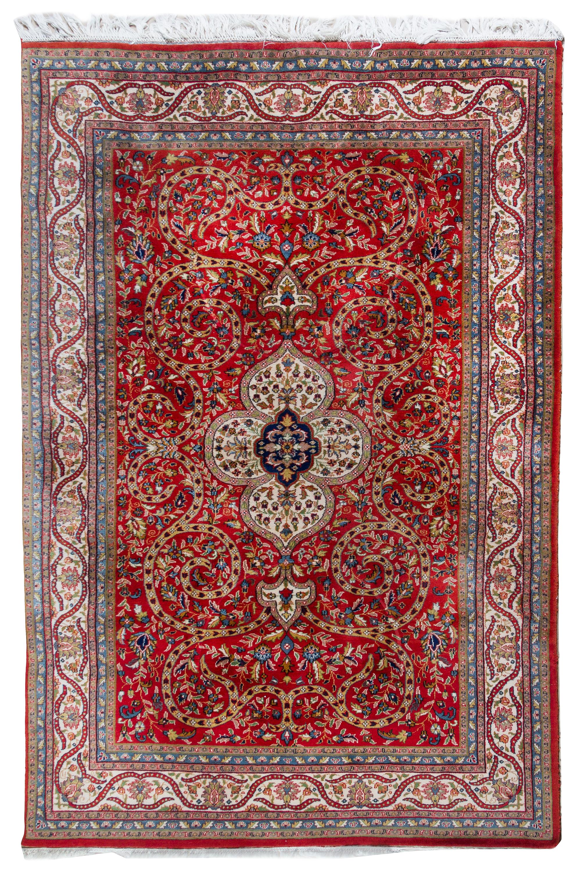 A Heriz Wool Rug 8 feet 11 inches x 5 feet 10 1/2 inches. — 20TH CENTURY