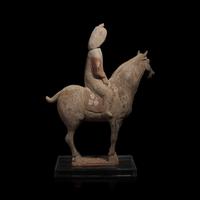 A Chinese Painted Pottery Female Equestrian Figure, Tang Dynasty — 唐 陶加彩女騎馬俑
