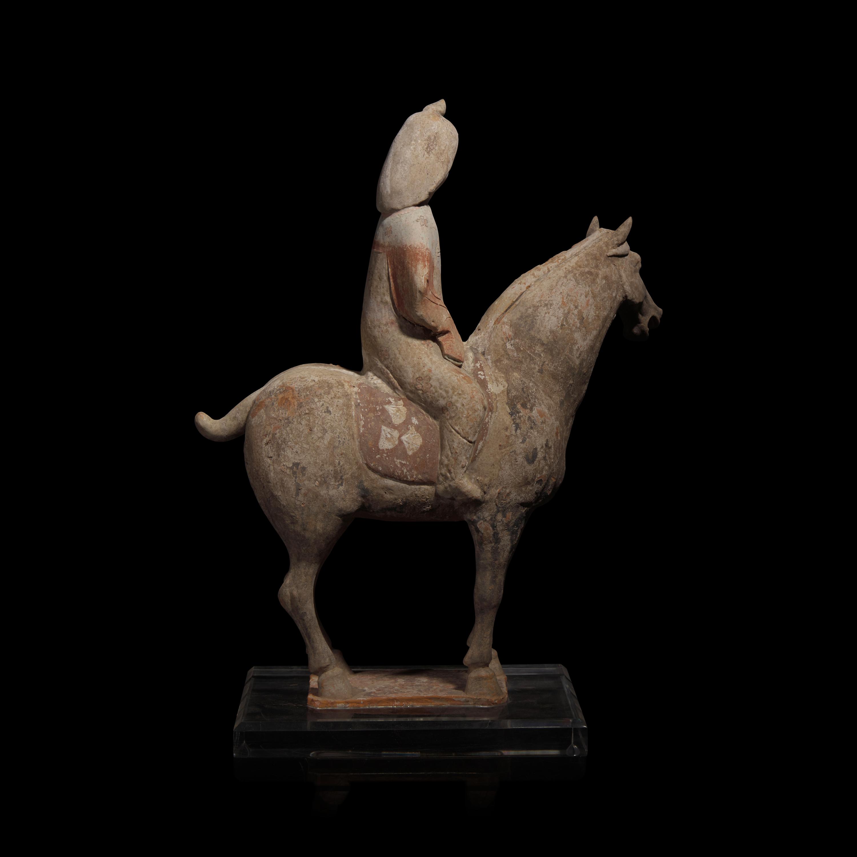 A Chinese Painted Pottery Female Equestrian Figure, Tang Dynasty — 唐 陶加彩女騎馬俑