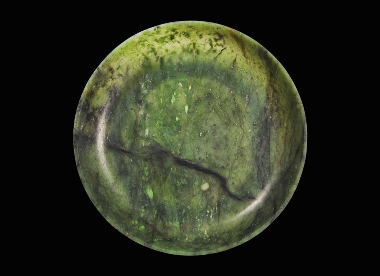 A Chinese spinach green jade circular dish, 18th / 19th century 翠玉小盤 十八或十九世紀