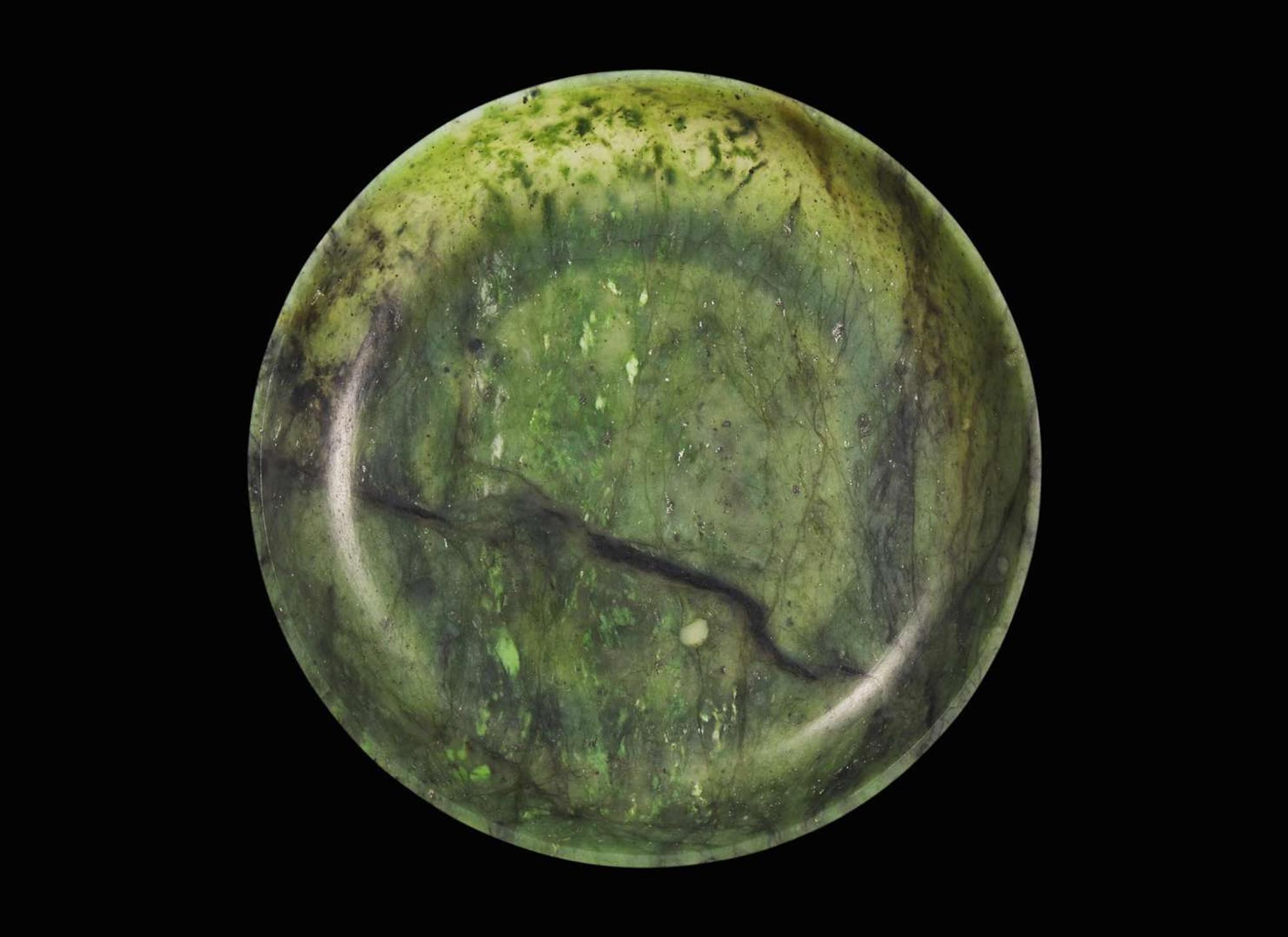A Chinese spinach green jade circular dish, 18th / 19th century 翠玉小盤 十八或十九世紀