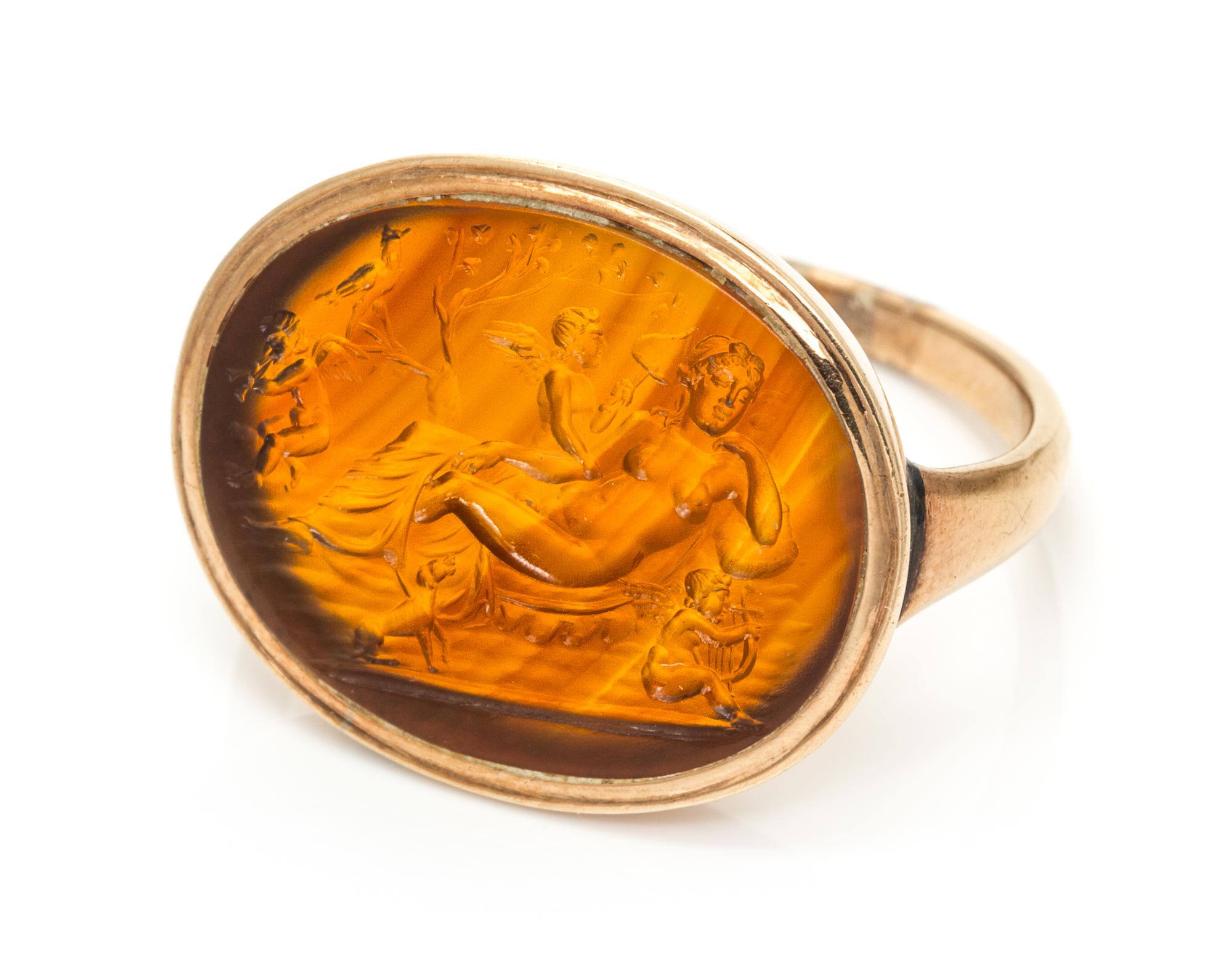 A Rose Gold and Citrine Hermaphrodite Intaglio Ring, 5.80 dwts.