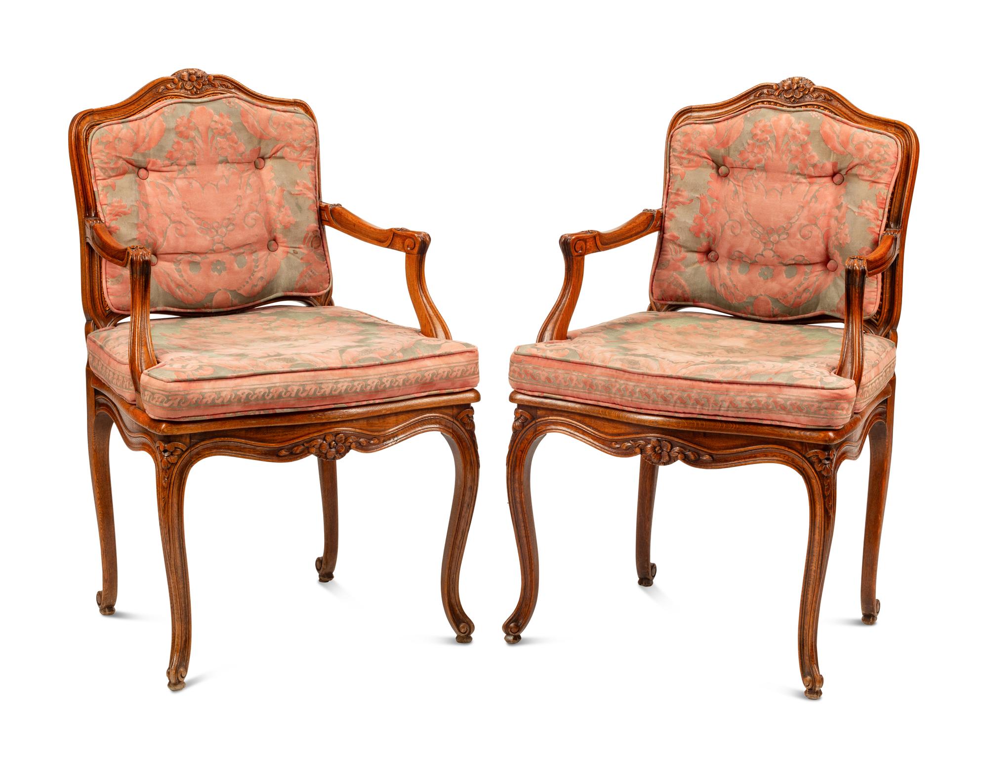 A Pair of Louis XV Style Oak Fauteuils