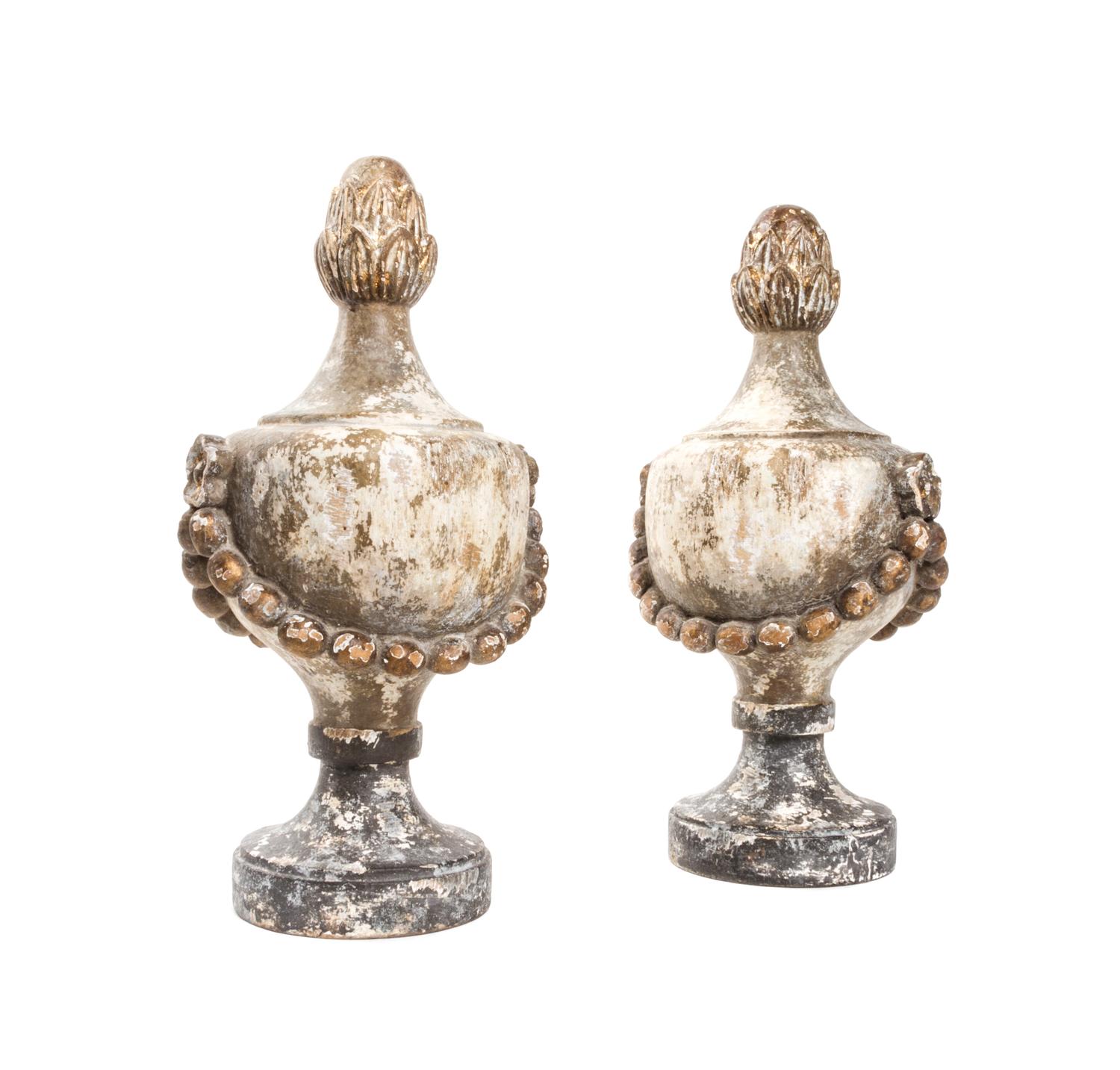 A Pair of Neoclassical Painted and Parcel Gilt Finials, Height 16 inches.