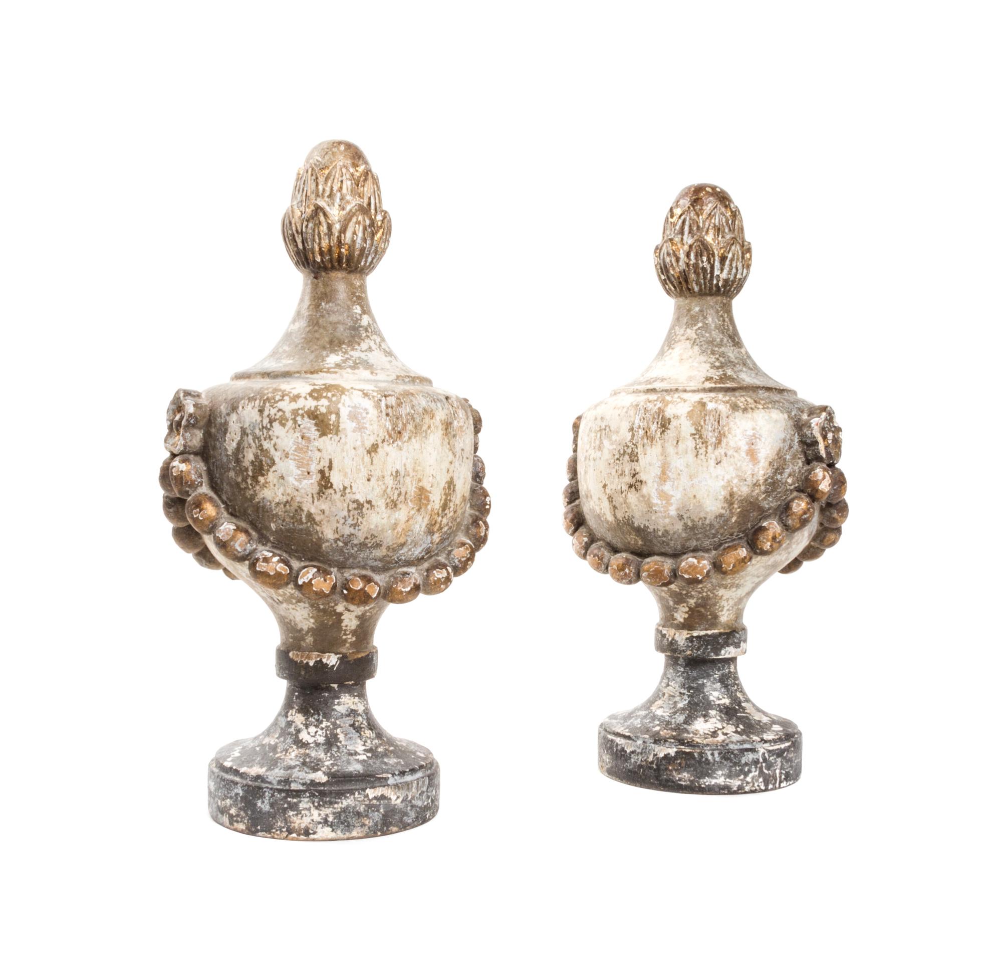 A Pair of Neoclassical Painted and Parcel Gilt Finials, Height 16 inches.