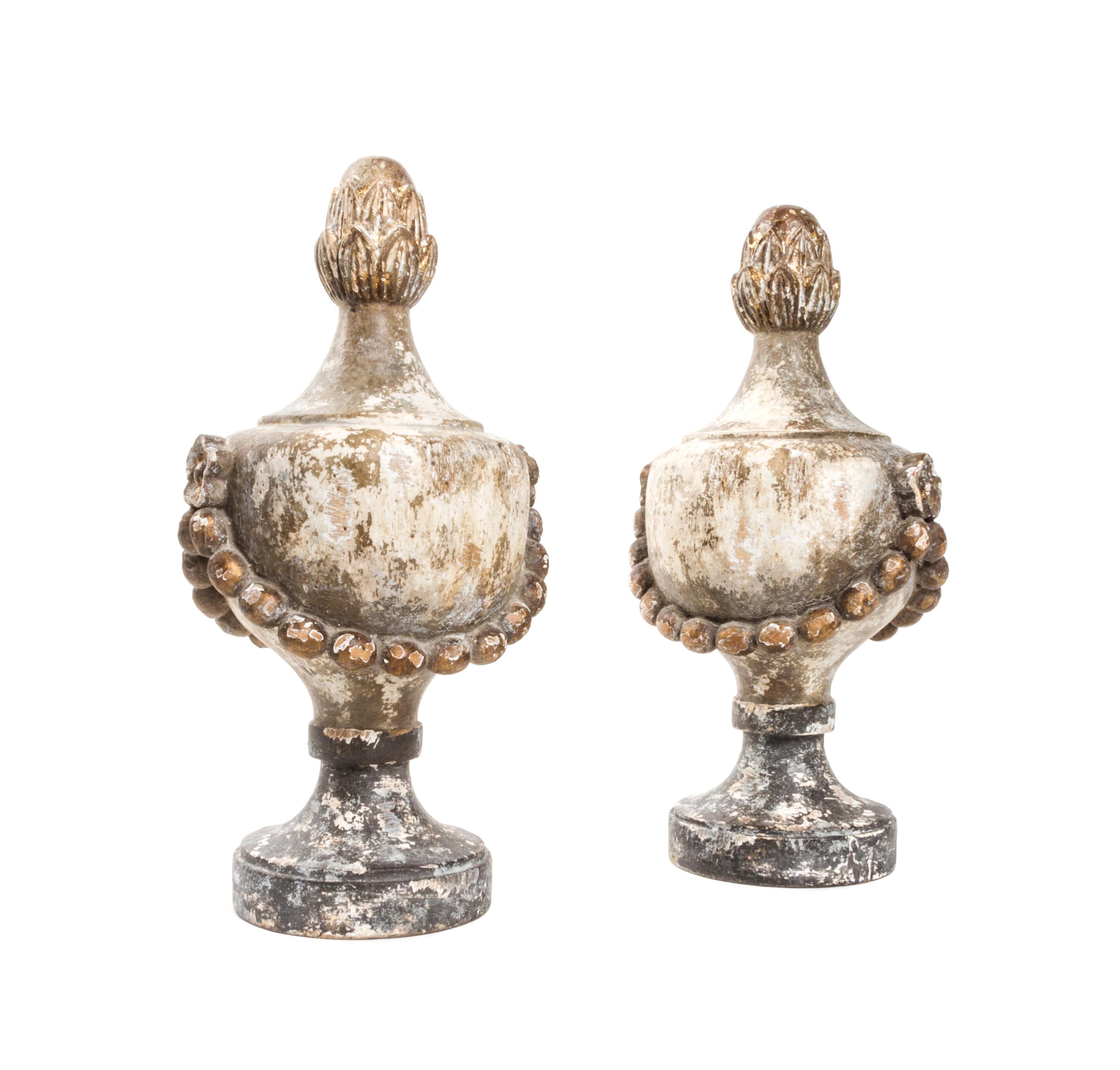 A Pair of Neoclassical Painted and Parcel Gilt Finials, Height 16 inches.