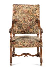 A Louis XIII Style Carved Walnut Armchair
