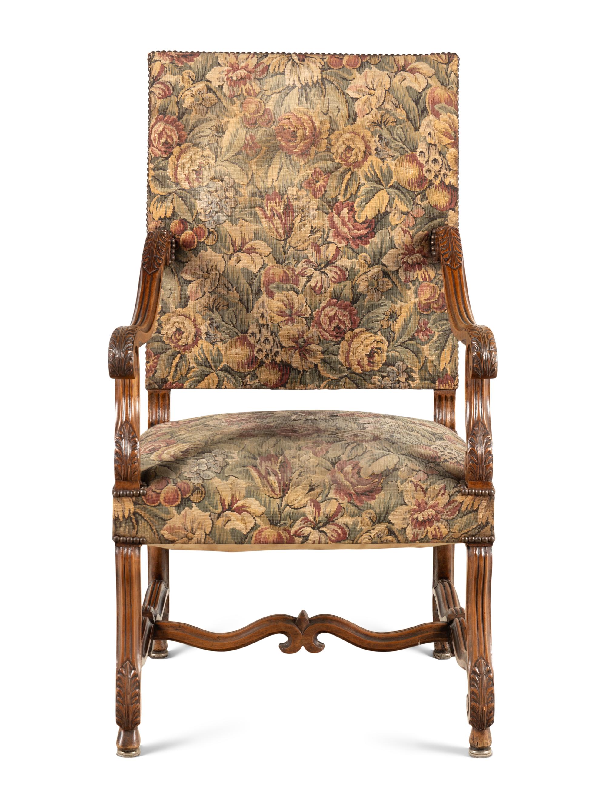 A Louis XIII Style Carved Walnut Armchair