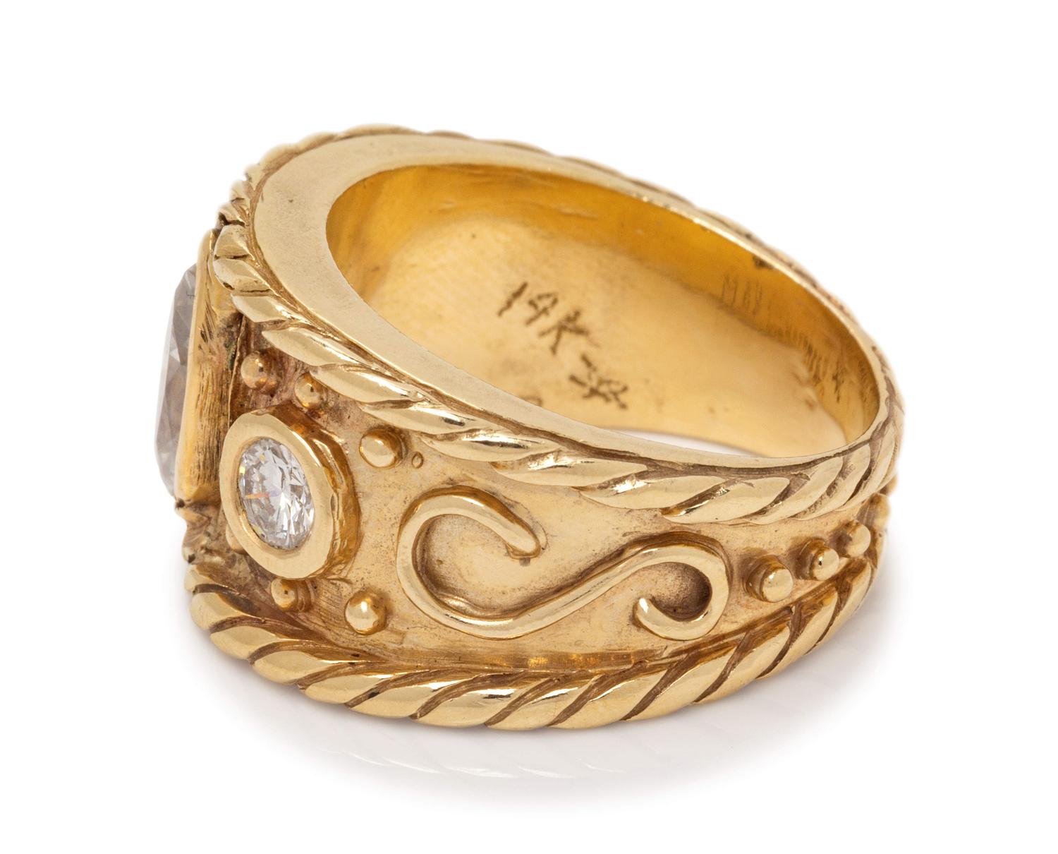 A 14 Karat Yellow Gold and Diamond Ring,