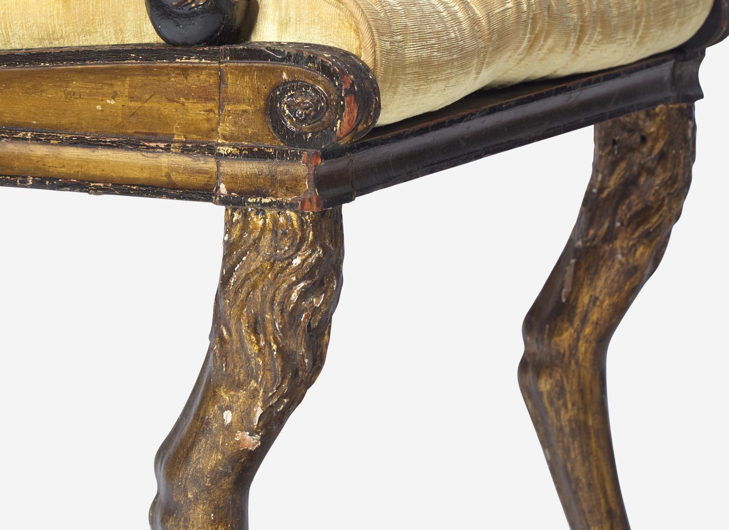 A Set of Three Regency Parcel-Gilt and Ebonized Caned Seat Dining Chairs