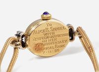 A Ladies 14K Yellow Gold and Diamond Watch by Tiffany & Co.