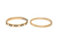 COLLECTION OF YELLOW GOLD BANGLE BRACELETS