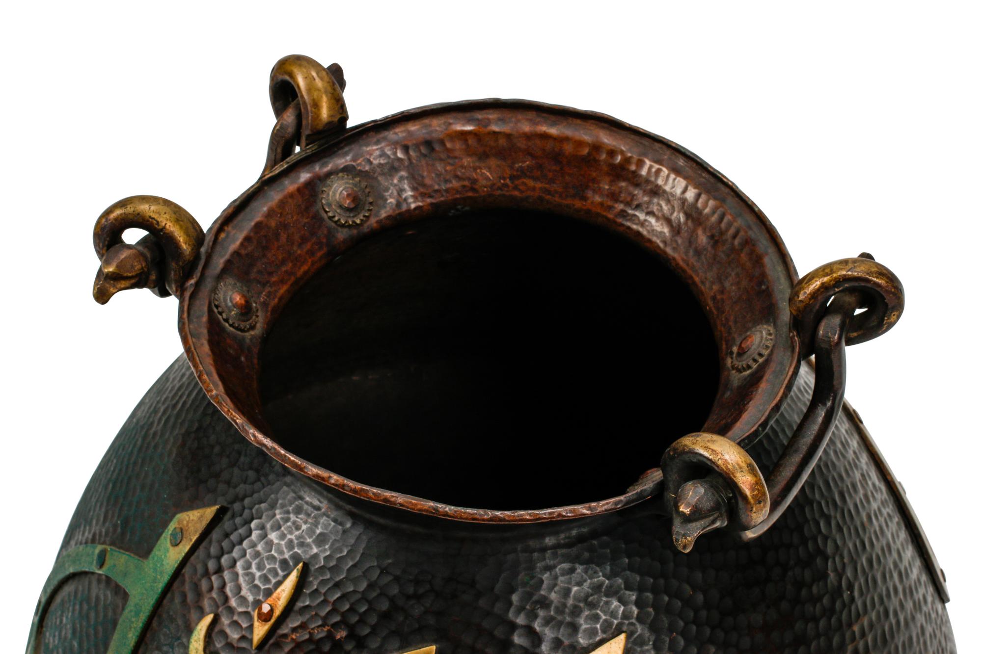 A Middle Eastern Hand-Hammered Vessel with Arabic Calligraphy