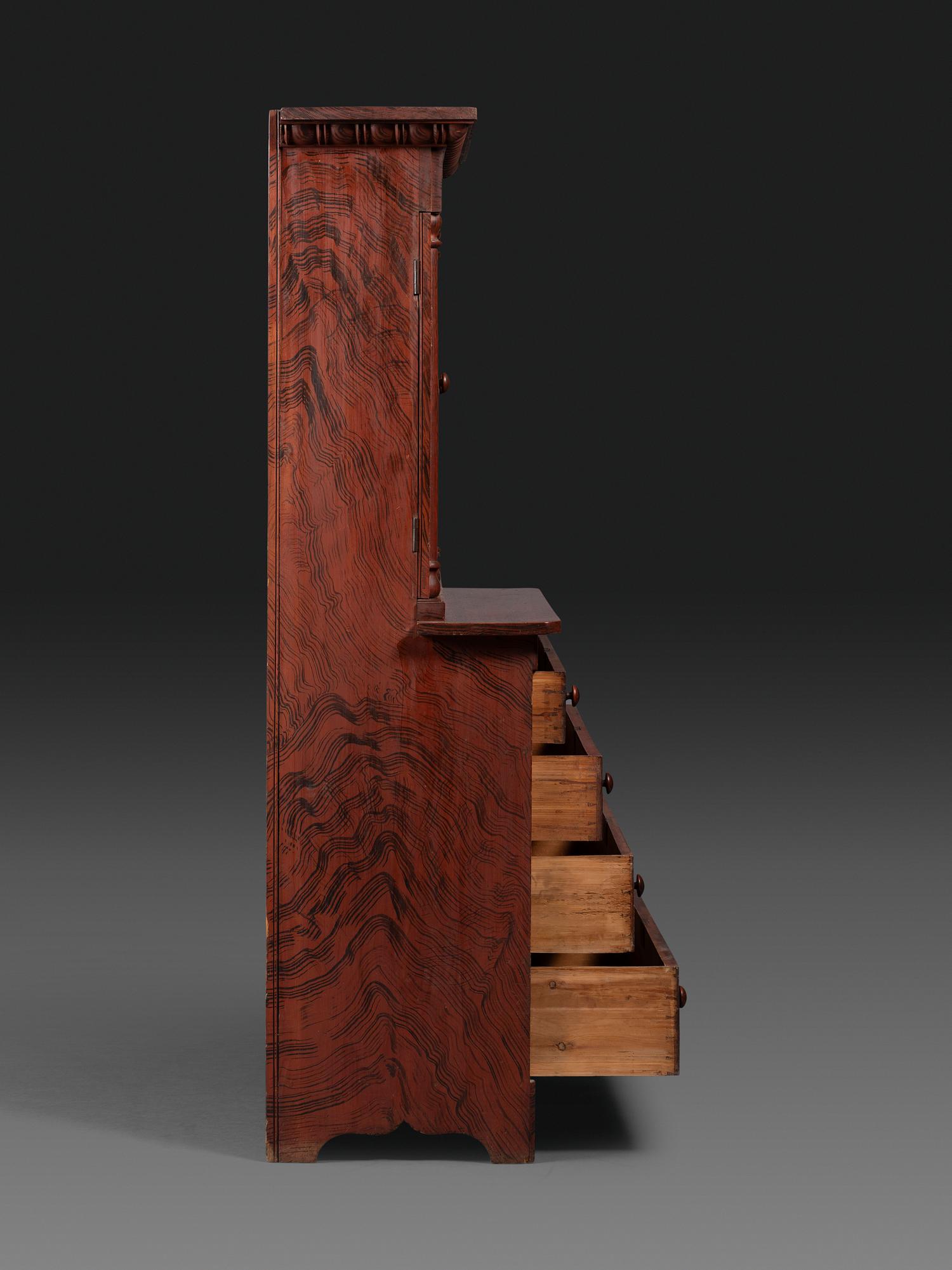 A Late Country Classical Grain Painted Pine Cupboard