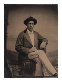 [AFRICAN AMERICANA - EARLY PHOTOGRAPHY]. Tintype of young African American man, likely occupational.