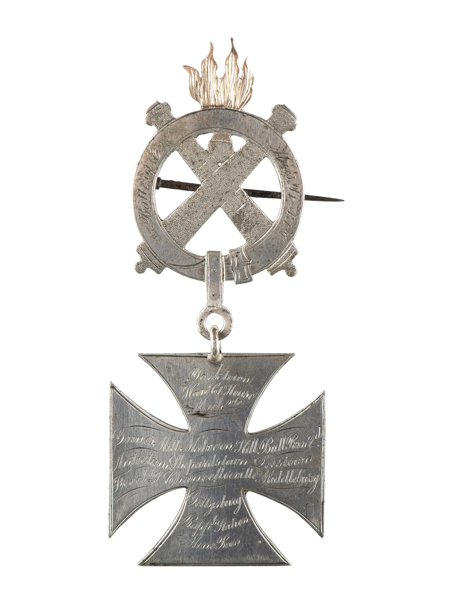 [CIVIL WAR]. Badge identified to Alfred J. Johnson, 1st, 3rd, and 5th Massachusetts Light Artilleries.