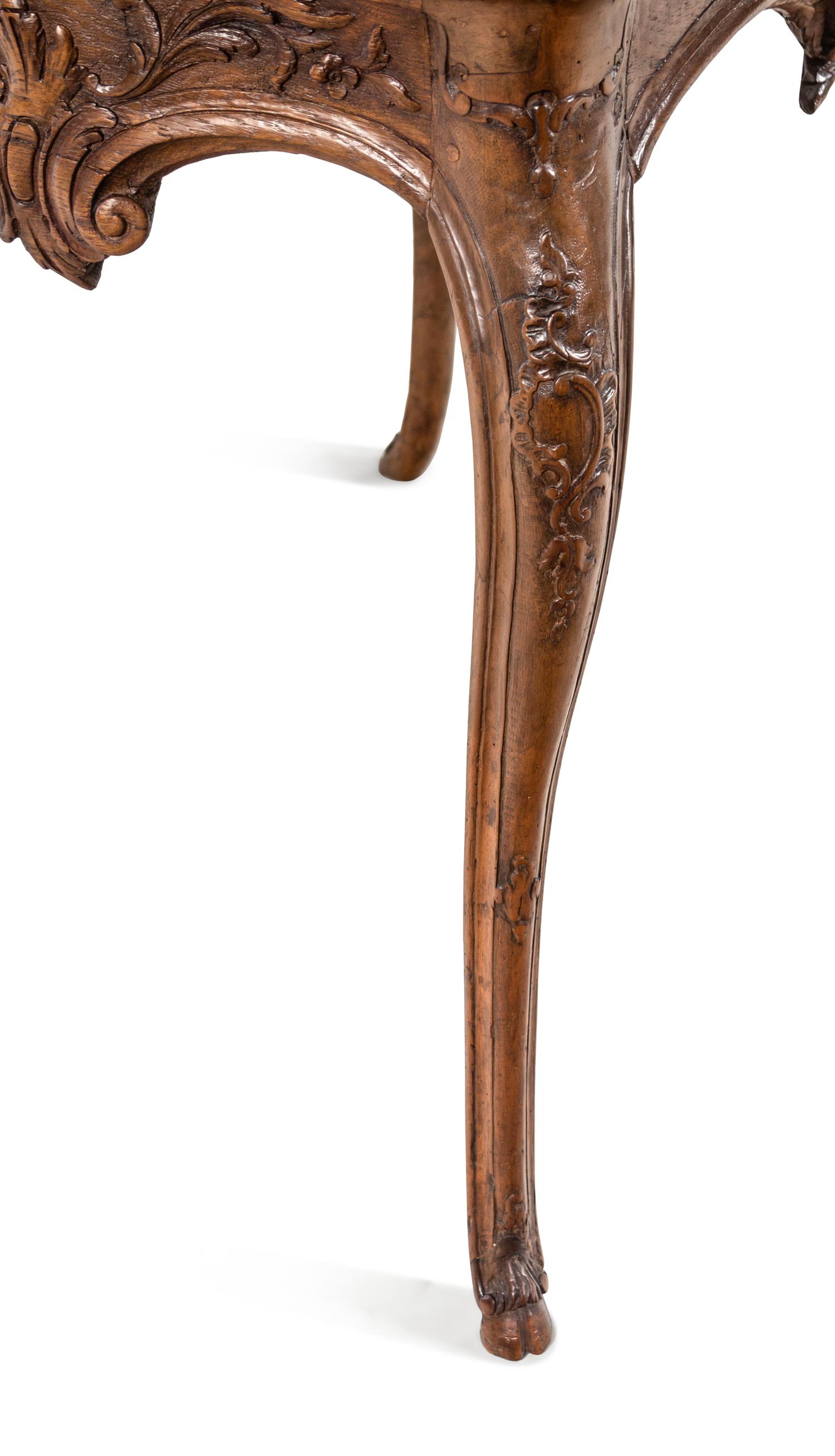 A Régence Carved Walnut Marble-Top Center Table