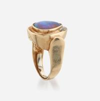 An opal, diamond, and gold ring