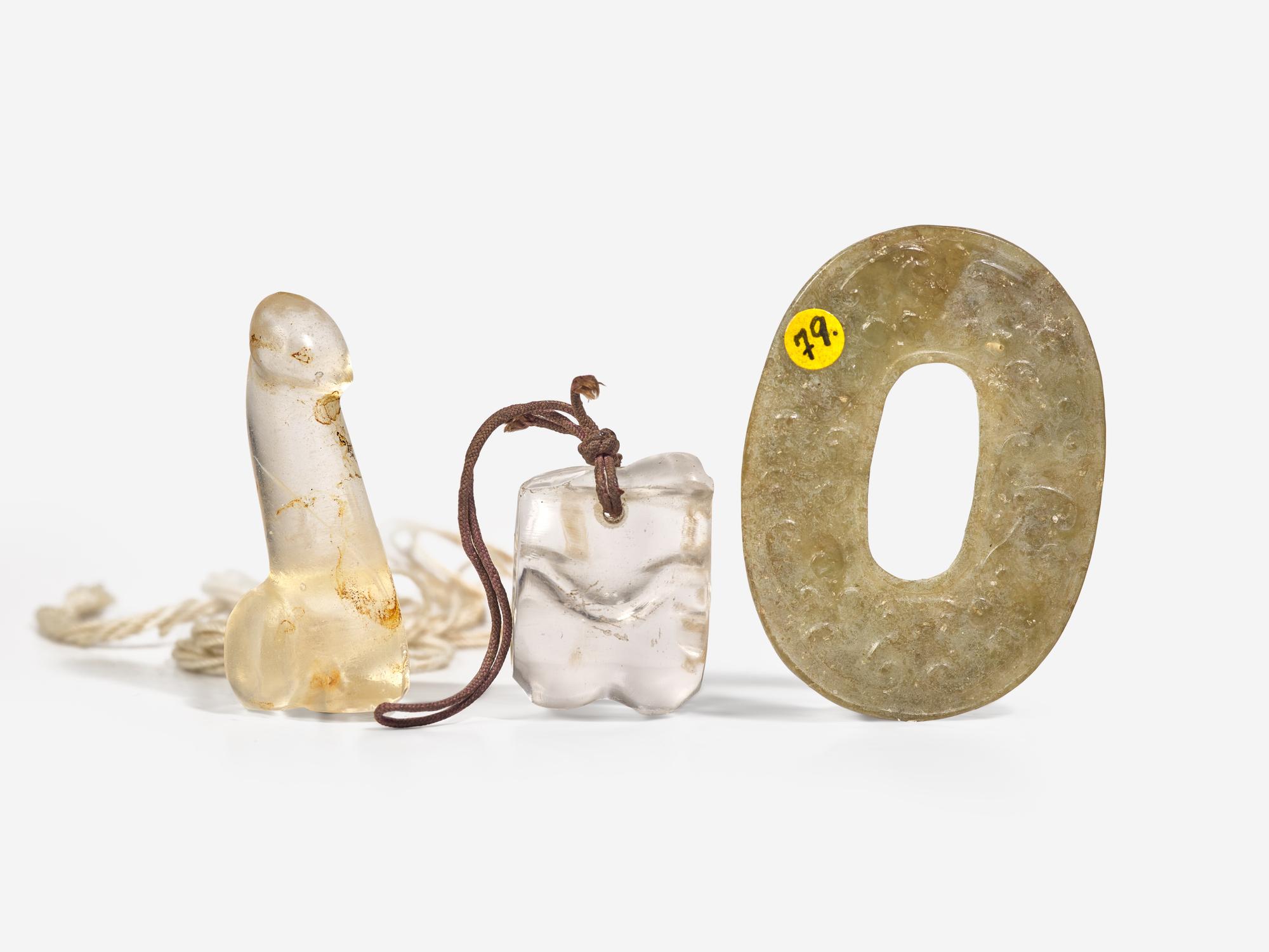 A Rock Crystal "Knucklebone", a Glass Phallus and a Chinese Archaistic Jade Ring