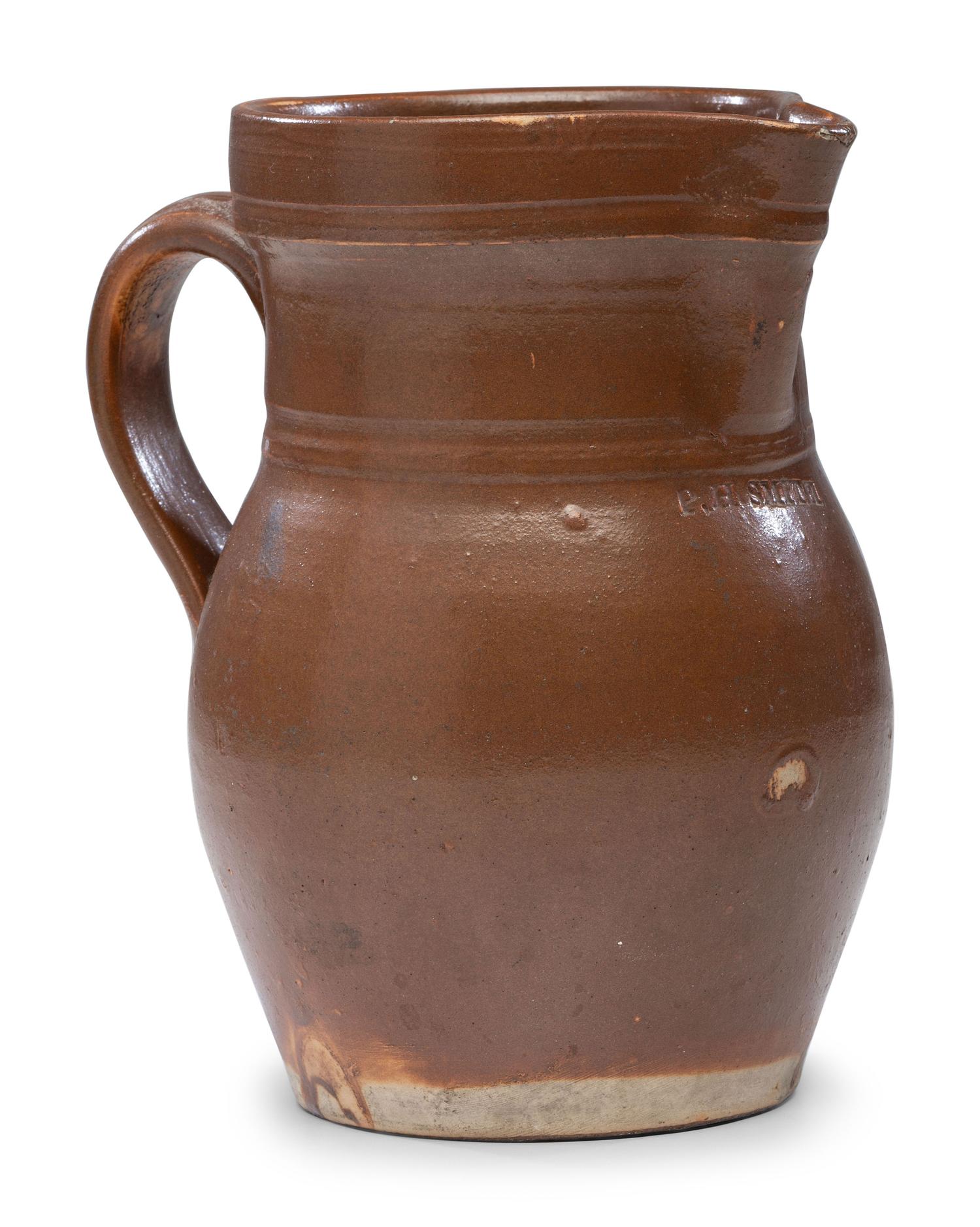 A P.H. Smith Albany Slip Stoneware Pitcher