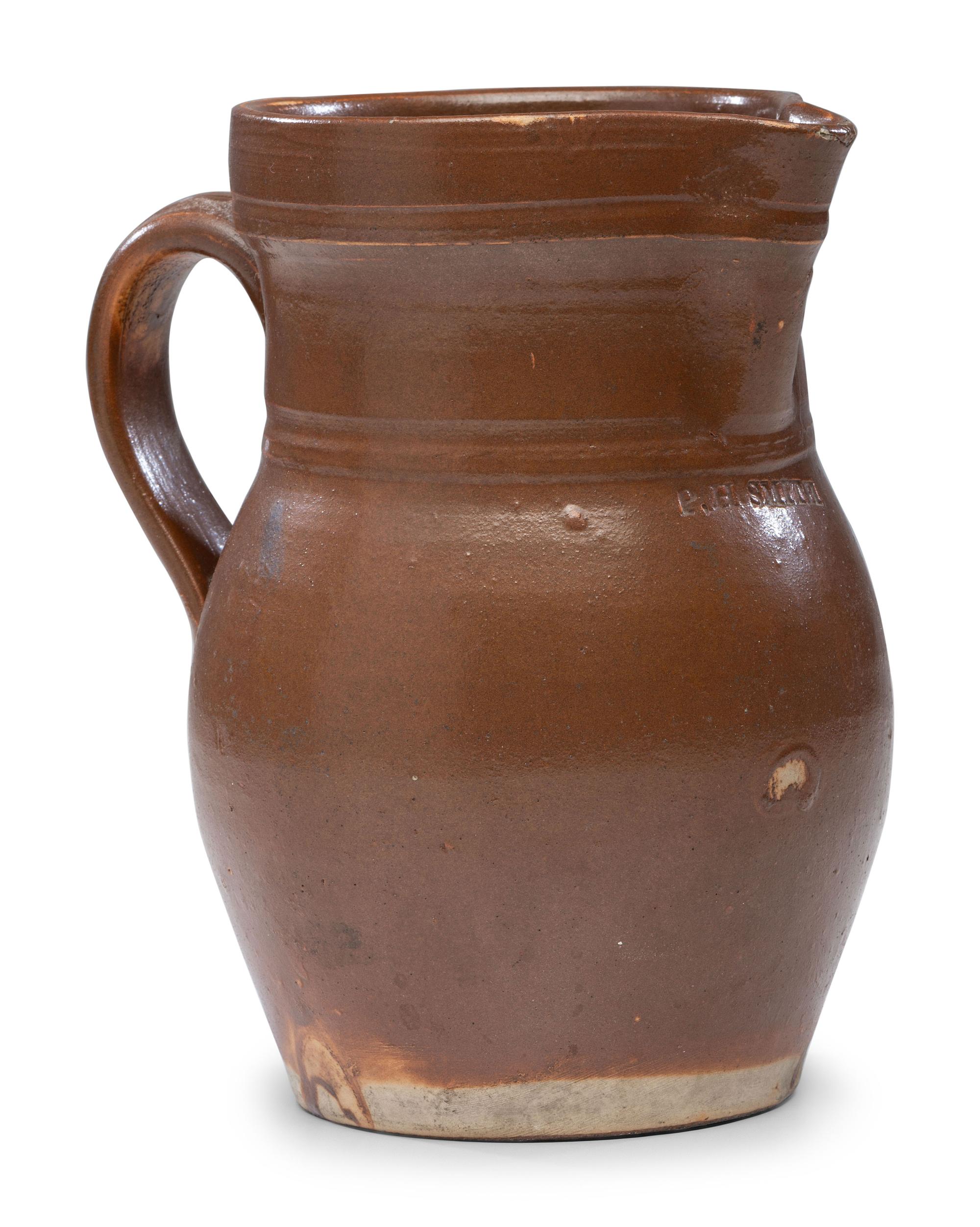 A P.H. Smith Albany Slip Stoneware Pitcher