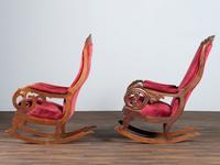A Matched Pair of Victorian Carved Walnut Rocker Armchairs
