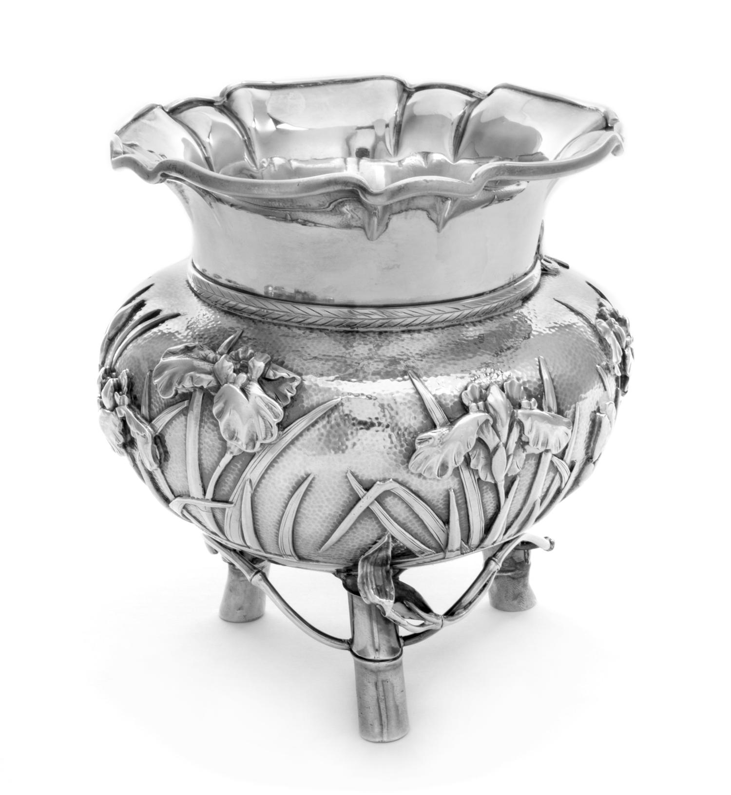 A Japanese Silver Bowl, Arthur & Bond, Yokohama, having a flared rim, the body having a continuous band of foliate decoration, raised o