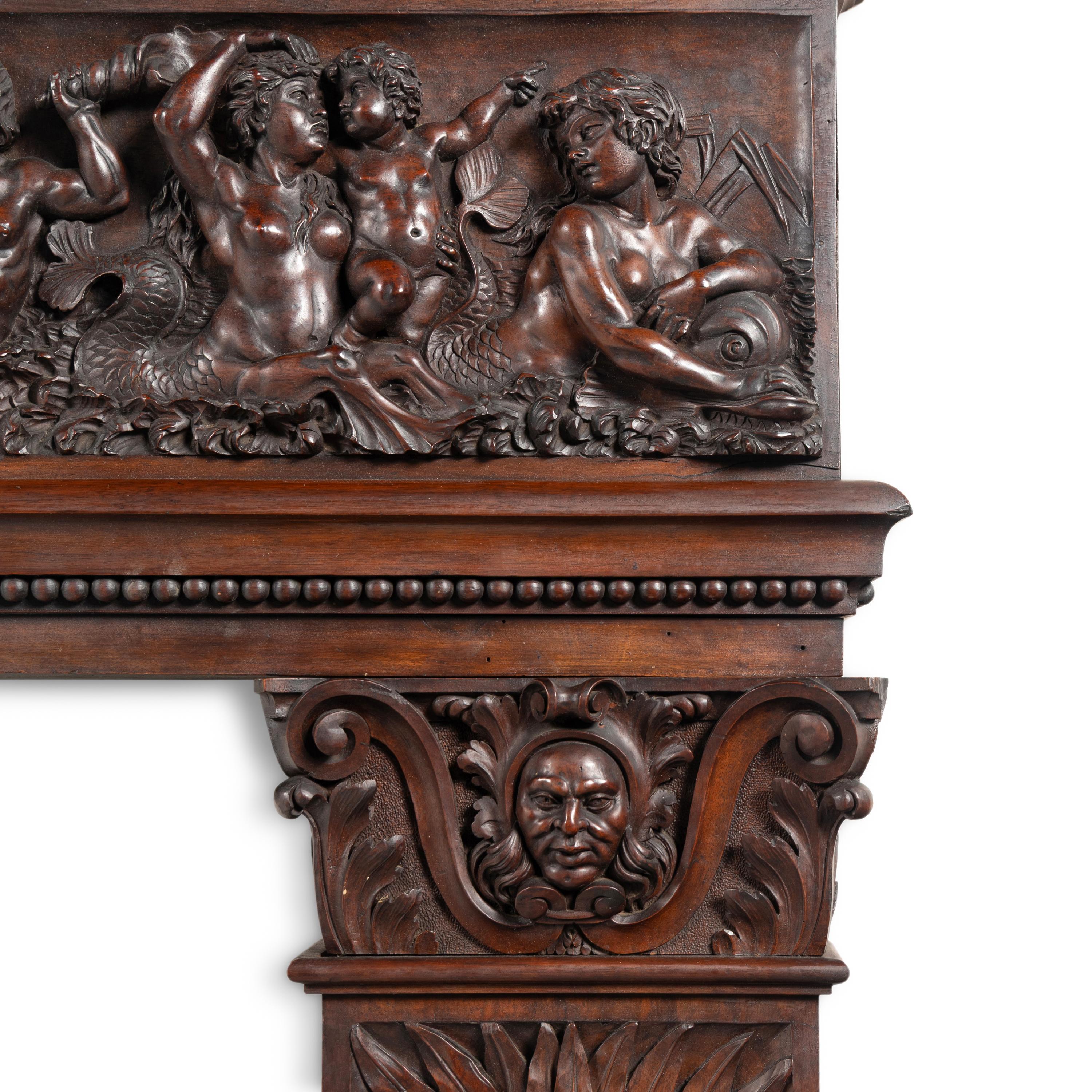 An Italian Carved Walnut Mantelpiece