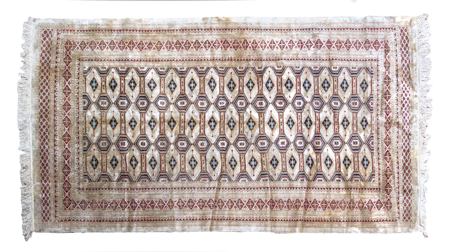 A Bokhara Wool Rug 7 feet x 4 feet 3 inches.