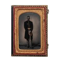 [CIVIL WAR]. Ruby ambrotype of unidentified, armed Union officer wearing II Corps (Second Army Corps) badge. N.p.: n.p., [1860s].