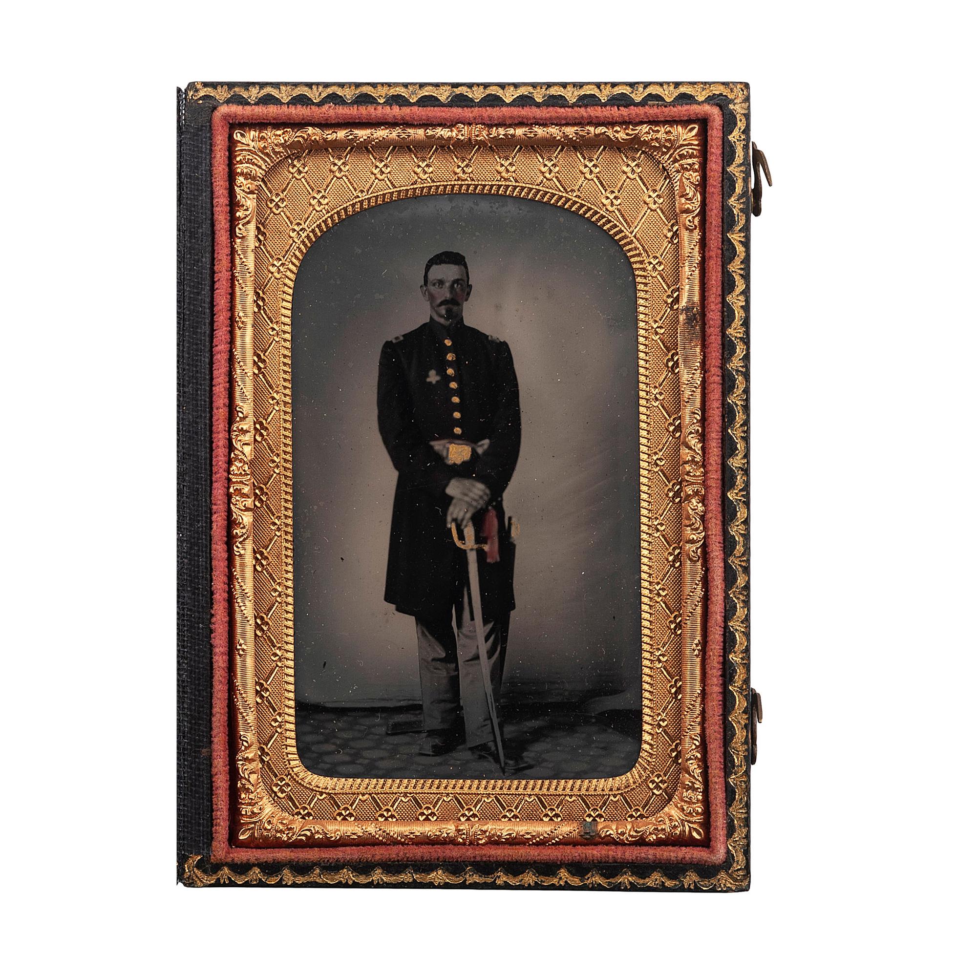[CIVIL WAR]. Ruby ambrotype of unidentified, armed Union officer wearing II Corps (Second Army Corps) badge. N.p.: n.p., [1860s].