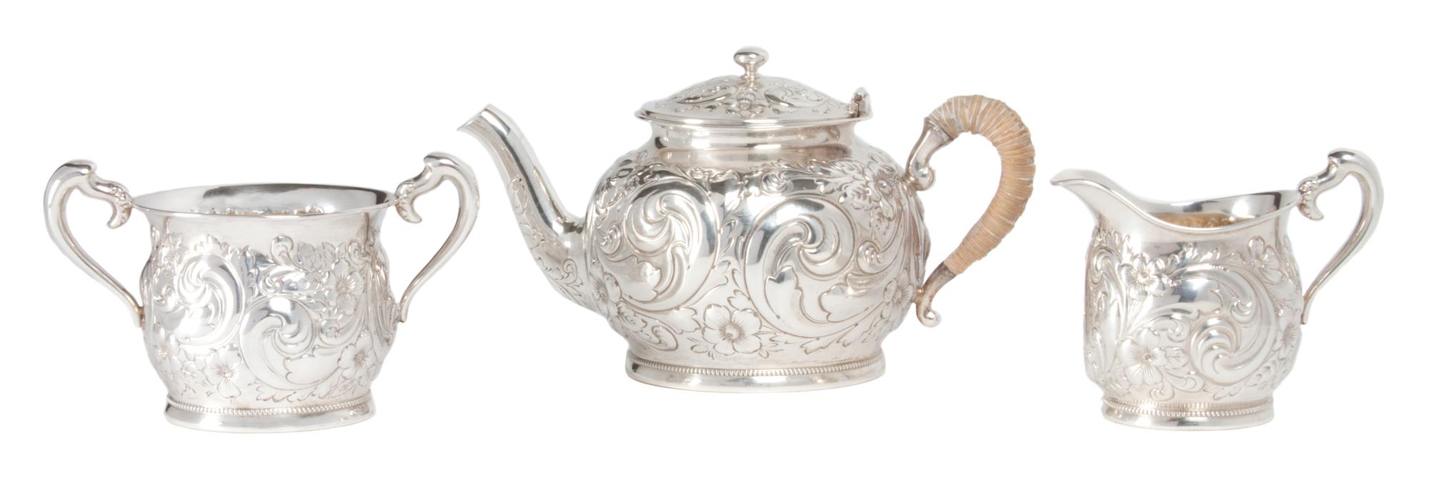 An American Petite Sterling Tea Set, Gorham Mfg. Co., Providence, RI, 1890, comprising a teapot, creamer, and sugar.