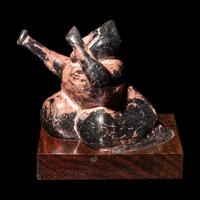 A Chinese Black and Red Lacquered Pottery 'Dancing Figure', Warring States or Later 戰國或以後 黑陶朱漆舞俑