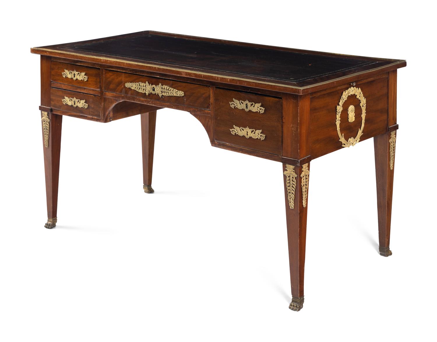 An Empire Style Gilt Metal Mounted Mahogany Bureau Plat and an Associated Armchair
