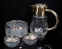 A Group of Silver-Plate Mounted Glass Table Articles Height of pitcher 11 3/8 inches.