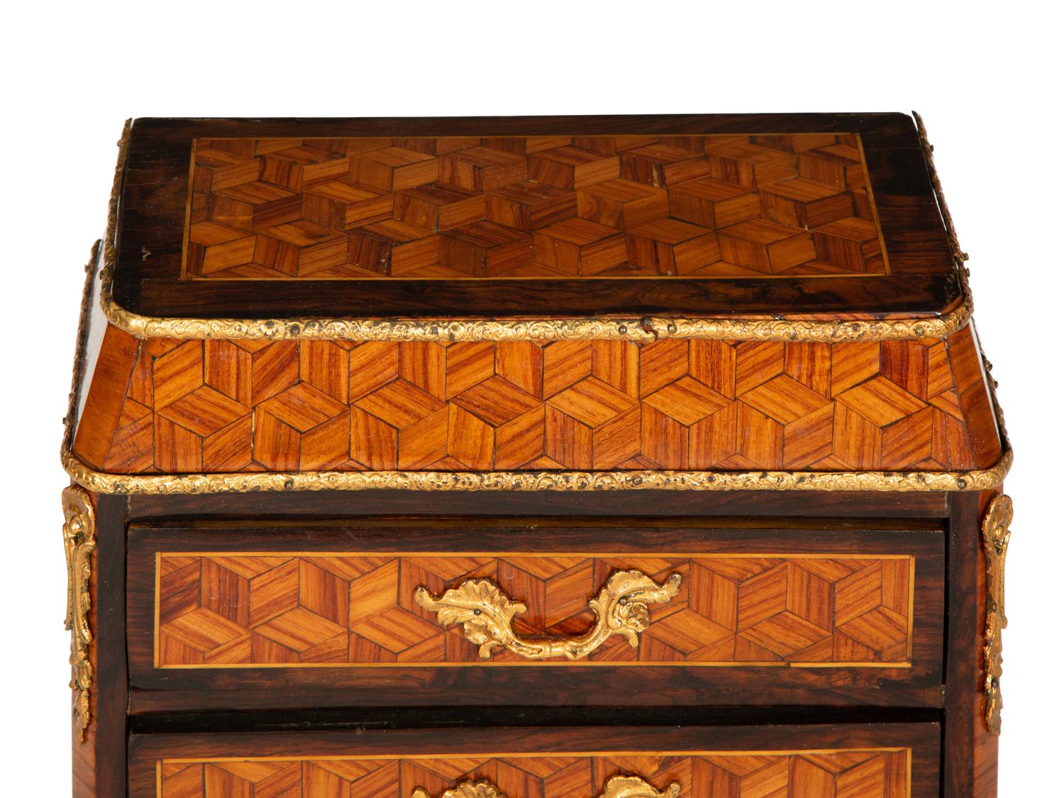 A Diminutive Gilt Bronze Mounted Parquetry Chest of Drawers