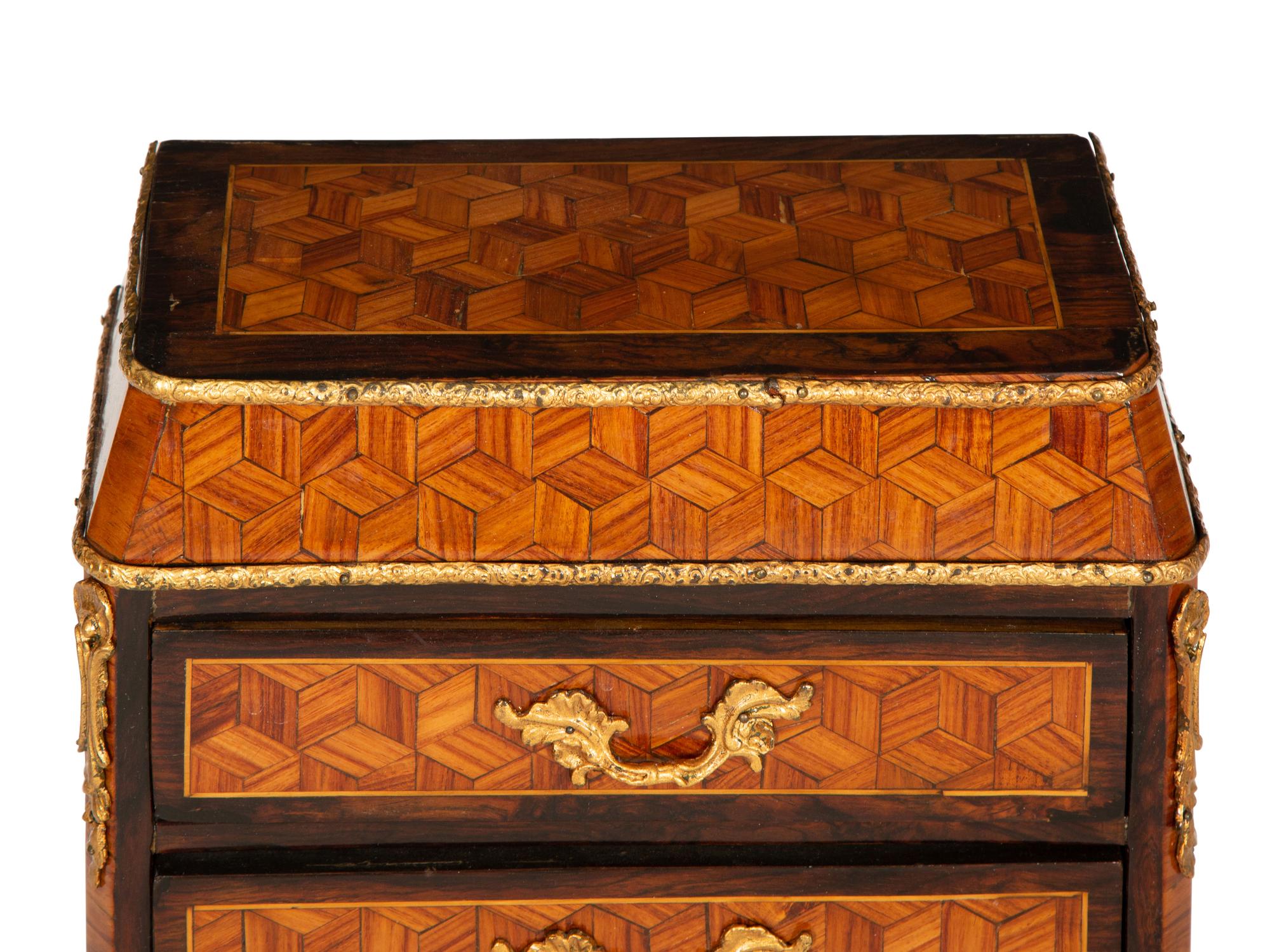 A Diminutive Gilt Bronze Mounted Parquetry Chest of Drawers