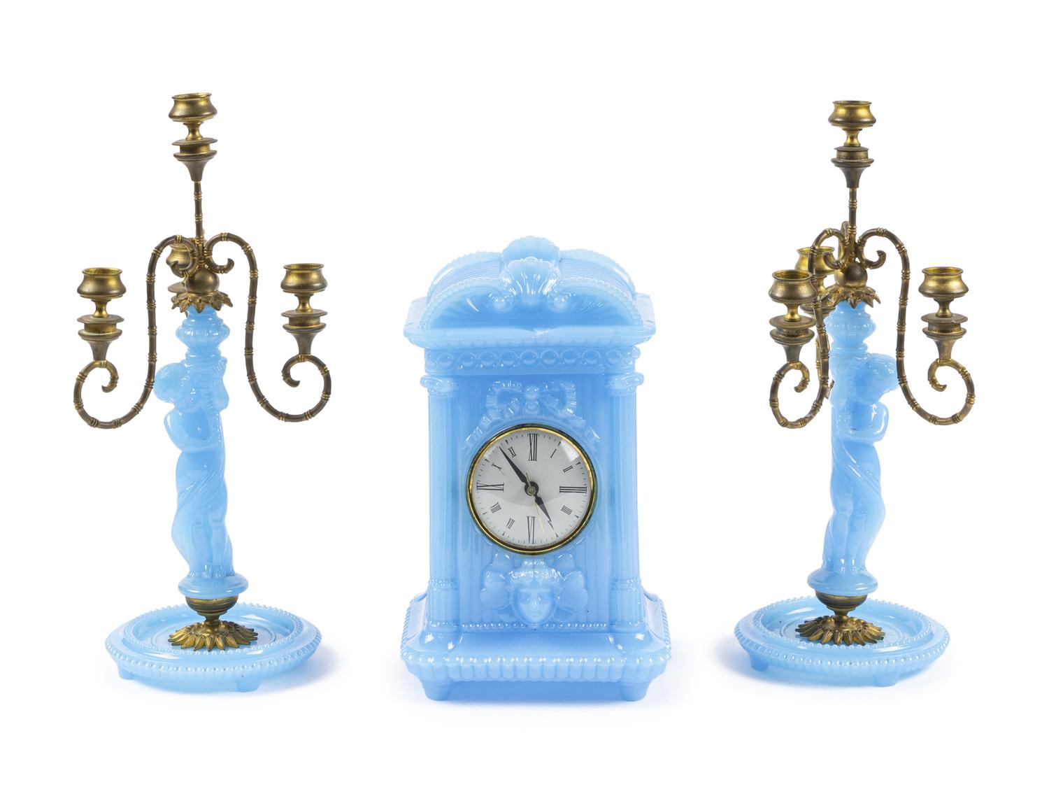 A Continental Blue Opaline Glass Three-Piece Clock Garniture