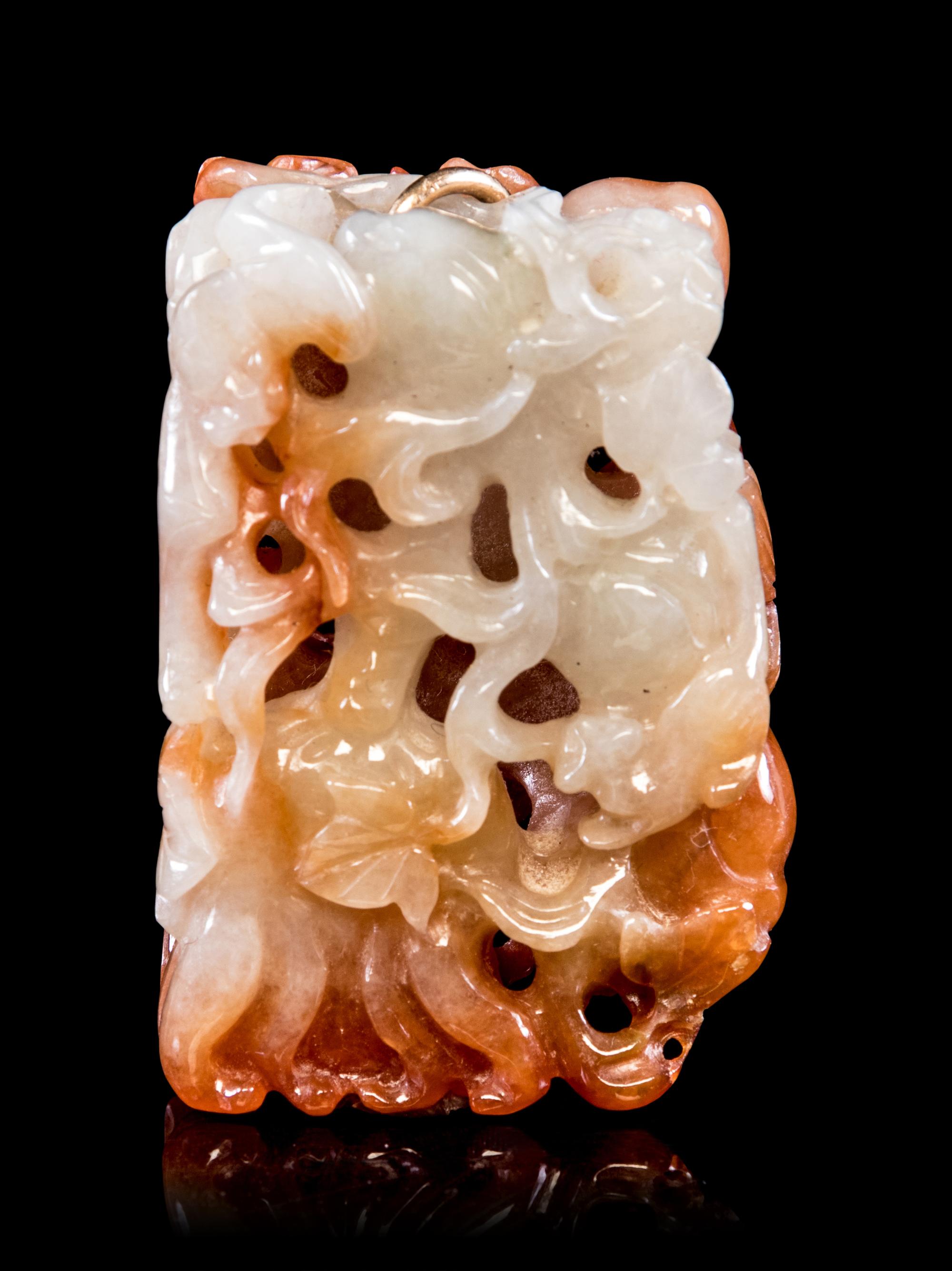 A Russet Jadeite Reticulated Pendant
