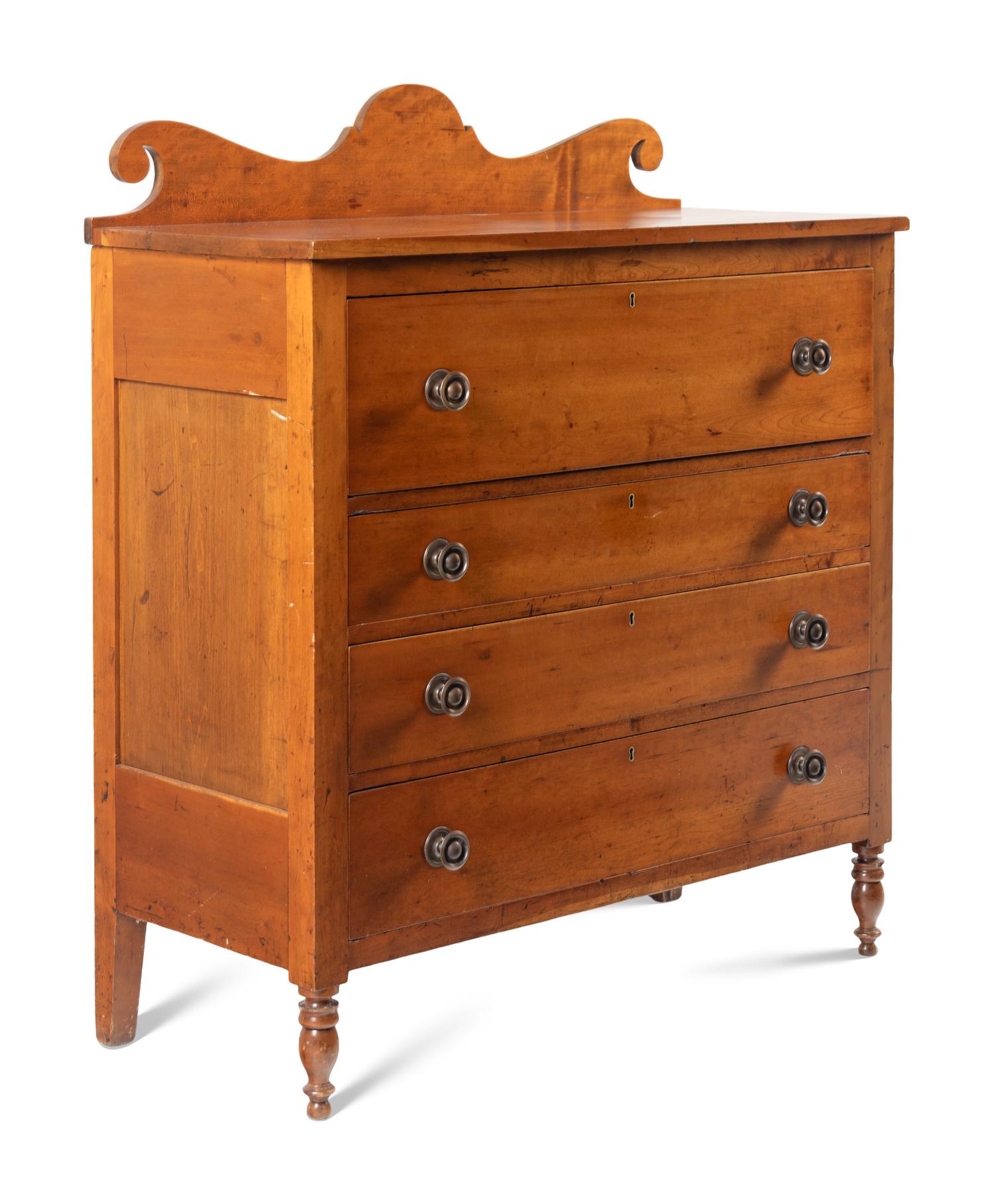 A Late Classical Carved Cherrywood Chest of Drawers