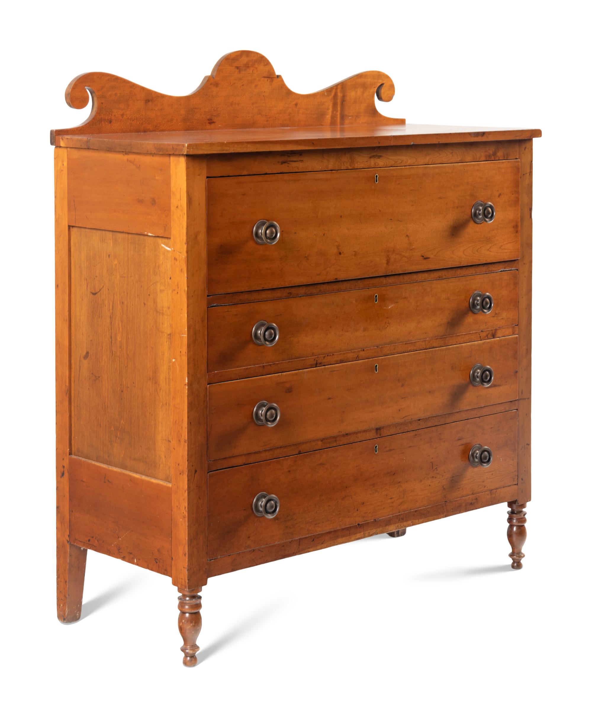 A Late Classical Carved Cherrywood Chest of Drawers