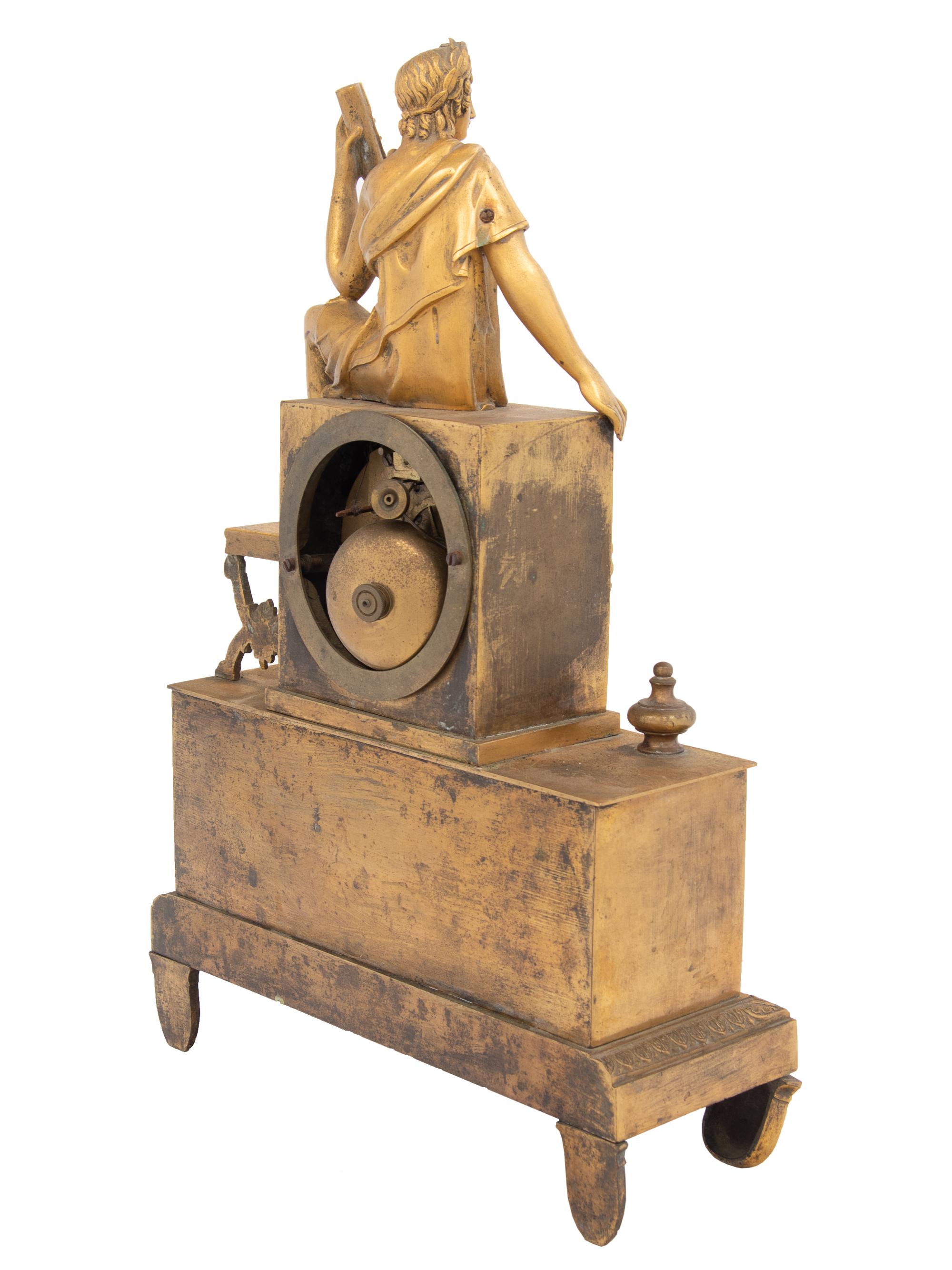 An Empire Style Gilt Bronze Figural Mantel Clock