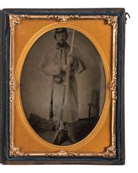[CIVIL WAR]. Quarter plate tintype of a Union soldier holding a rifle with fixed bayonet.