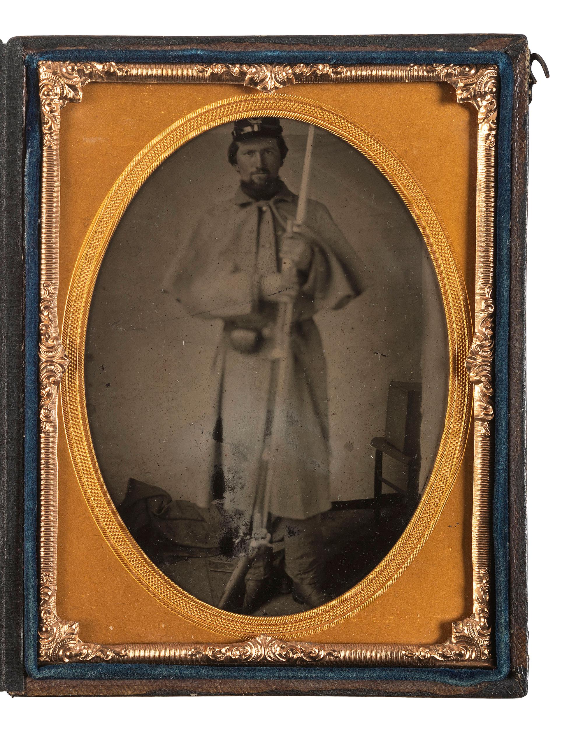 [CIVIL WAR]. Quarter plate tintype of a Union soldier holding a rifle with fixed bayonet.