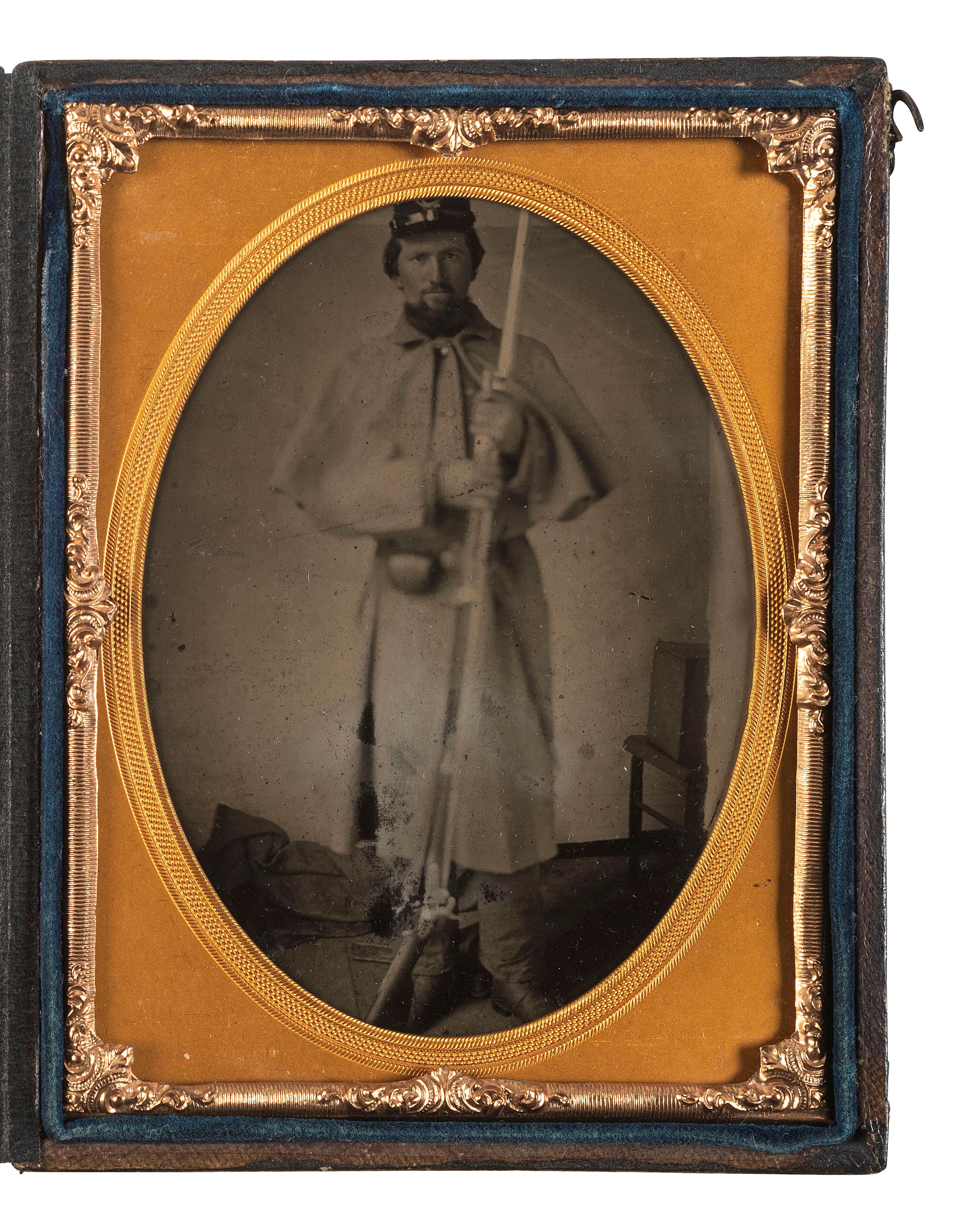 [CIVIL WAR]. Quarter plate tintype of a Union soldier holding a rifle with fixed bayonet.