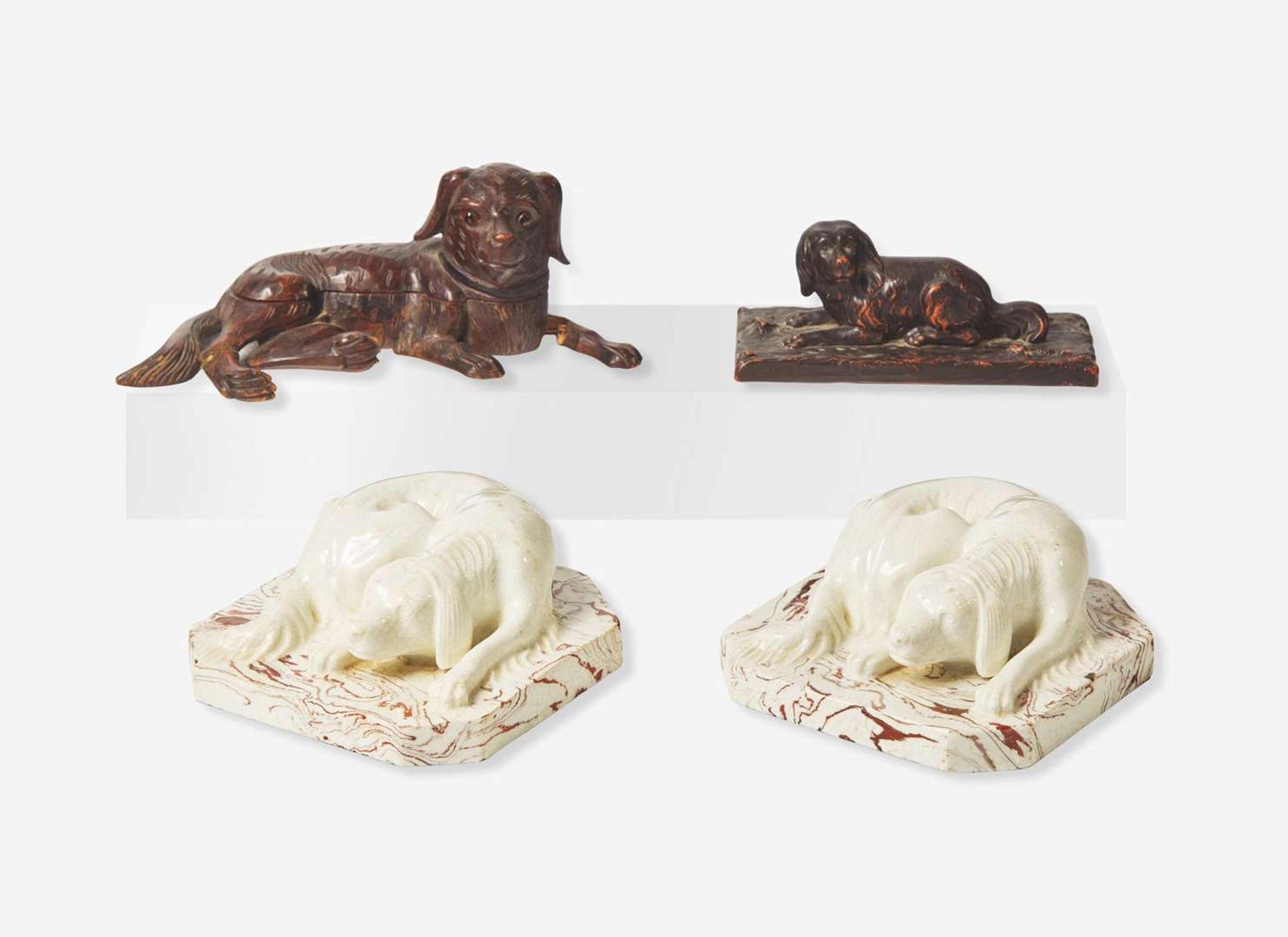 A group of ceramic and wood figures of dogs, 19th / 20th century