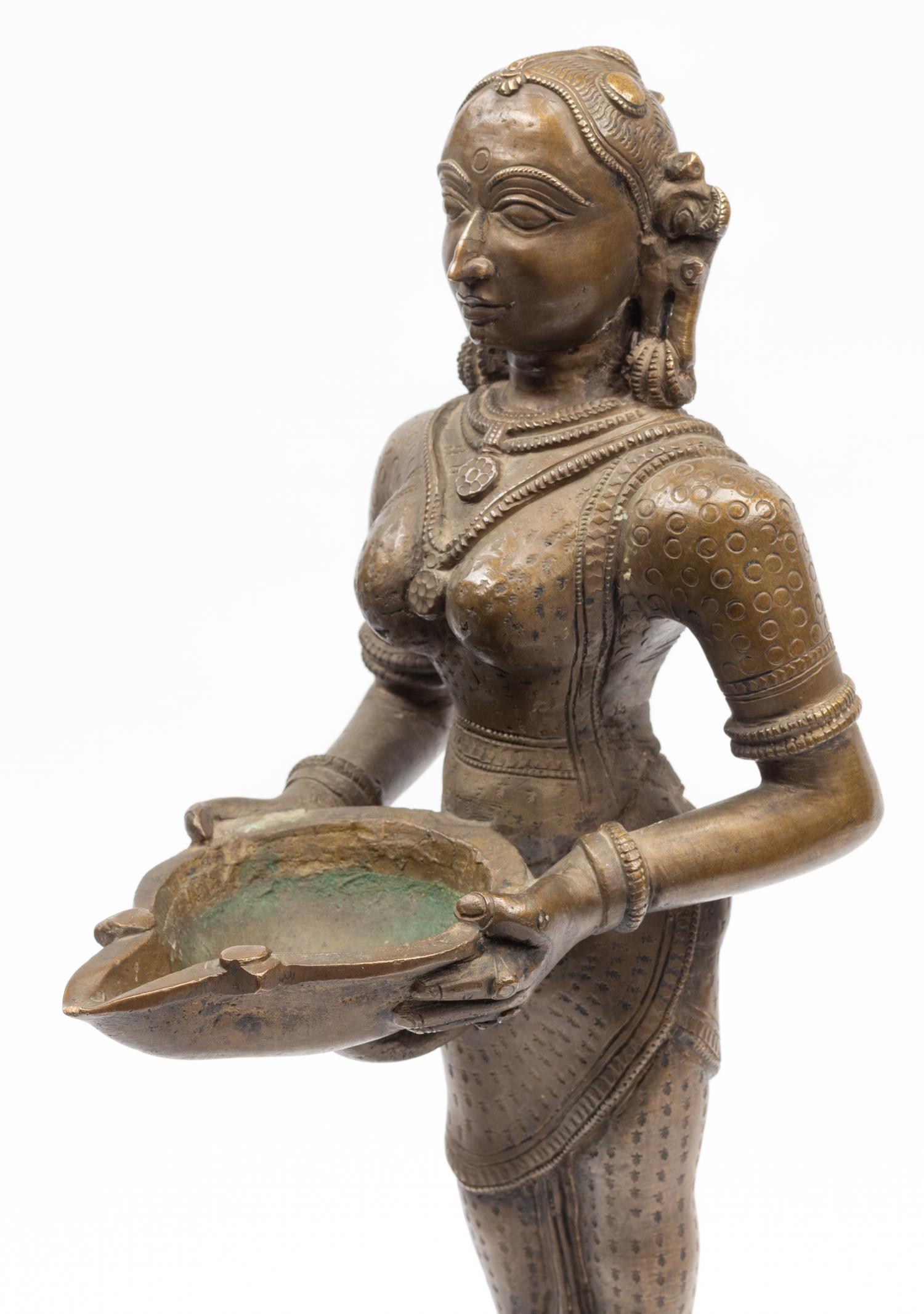 An Indian Patinated Metal Figure of a Standing Deity