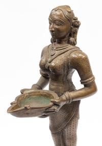 An Indian Patinated Metal Figure of a Standing Deity